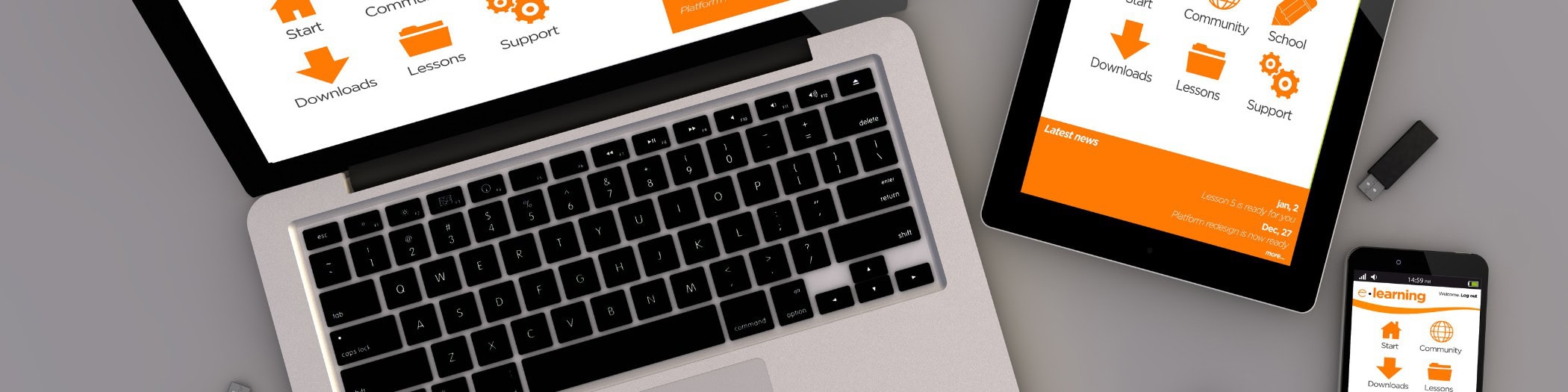 A laptop, tablet and phone with an orange icon on the screen.